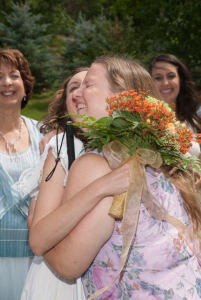 Arielle and KJ hug at Arielle's wedding