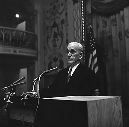 John W. McCormack, Speaker of the House of Representatives, stands at the podium during his speech to the convention.