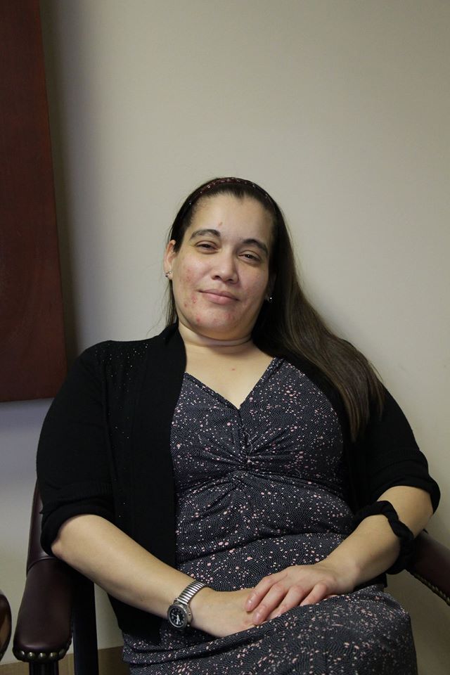 Portrait of Isabel Espinales sitting in a chair