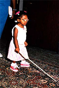 Mikaella Besson of Massachusetts has a lesson using her white cane during the cane walk.