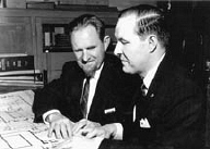Dr. Jernigan shows the Iowa Commission for the Blind's blueprints to Dr. tenBroek.