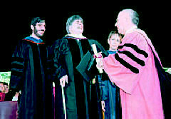 Adrienne Asch in academic regalia receives an honorary degree.