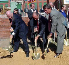 Congressman Ben Cardin, Jim Gashel. and Congressman Bob Ehrlich clear sand away rom the top of the buried box.