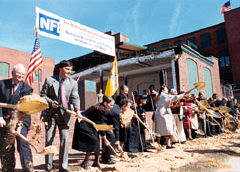The row of dignitaries prepares to let the dirt fly.