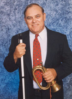 David Evans, cane in one hand and the bugle he soumds in the other.