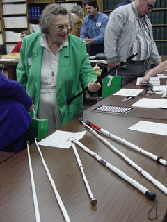 Lillian Lee examines canes on display at the fair