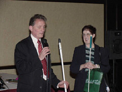 President Maurer was one of the performers at Karaoke Night.   He sang, "The Preacher and the Bear."   He is pictured at the microphone with Joyce Scanlan lookin on.
