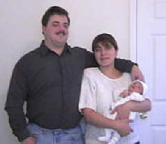 Scott and Anahit LeBarre holding son Alexander.