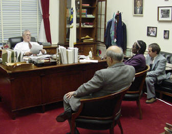 Congressman Barney Frank (seated behind his desk) meets with members of the Massachusetts affiliate