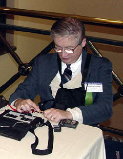 Curtis Willoughby works at the FM receiver check-out table.