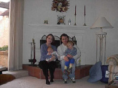Noel Nightingale and Jim Peterson hold their children Cosmo and Leila.