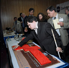 Brian Buhrow examines a three-dimensional model of the crater where the Spirit Rover has landed on Mars.