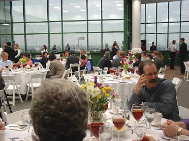 April 7 and 8, 2004, marked the first conference conducted in the new NFB Jernigan Institute.   The June issue will include a complete report of the event  In the picture above, conferees were beginning to gather in Members Hall on the top floor of the Institute for the festive closing dinner.  The view to the west of the facility can be seen from the windows facing Byrd Street.