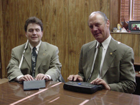 Jim Gashel, NFB executive director of strategic initiatives, is enthusiatic about his PAC Mate, which he uses with his cell phone to download email on his way to the office in the morning,  Mark Riccobono, NFB manager of education services, is equally committed to his Braille Mate.