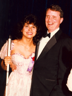  In 1988 Mildred Rivera received the top NFB scholarship. She is pictured here with NFB President Marc Maurer. Today Mildred is a member of the NFB of Maryland board of directors, a member of the National Association of Blind Lawyers board, and an attorney with the Equal Employment Opportunities Commission, serving as special assistant to EEOC Chair Cari Dominguez on the New Freedom Initiative.