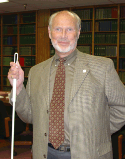 Jim Omvig poses with his cane.