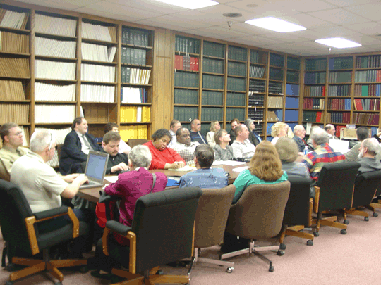 A number of the presidents are pictured here intently listening to a presentation.