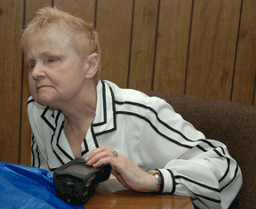 Diane McGeorge investigates the navigation controls of the Kurzweil�National Federation of the Blind Reader.
