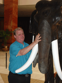  A Federationist examines one of the carved elephants flanking the doors of the Chantilly Ballroom.