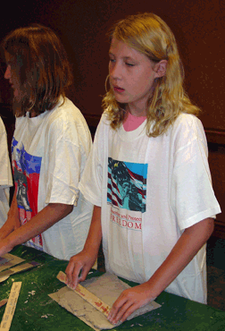 Hannah Weatherd of Wyoming models clay during the Art-Is-for-Everyone youth workshop during the 2006 convention.