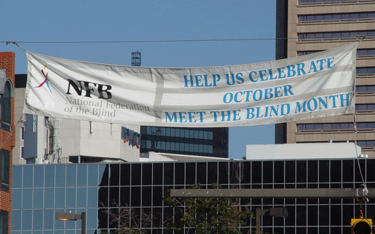On October 16 the Meet the Blind Month banner took its place in downtown Baltimore.