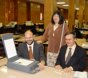Mike Tindell (left) is seated at the SARA. Beside him are Anne Taylor (standing) and Steve Booth (seated).