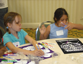 Two preschoolers enjoy crafts in NFB Camp.