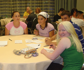 Group of teens at a table.