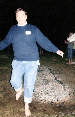  John Bailey stepping off a bed of hot coals