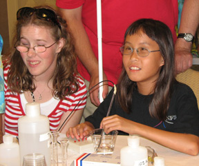 Jenny Wing-Proctor (MI) and Winona Brackett (FL) conduct a chemical experiment.
