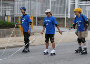 Some traveled the march route by golf cart; some rode on buses. Most marchers walked�Seth Lamkin, Miriam Rio, Clara Van Gerven, and their travel teacher Amy Phelps (all sighted National Center staffers) did the 5K walk under sleepshades. But the prize for the most novel form of transport goes to Maurice Peret (left), LisaMaria Martinez (center), and Tai Tomasi (right), who used inline skates.
