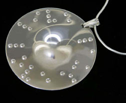 Braille text on a sterling or gold electroplate over sterling disk with a Braille message of your choice