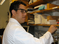 Cary Supalo and his adviser, DuPont Professor of Materials Chemistry and Physics Tom Mallouk, received an NSF grant to create equipment to help visually impaired students gain more independence in the lab. Here Cary Supalo works on an experiment in his lab.