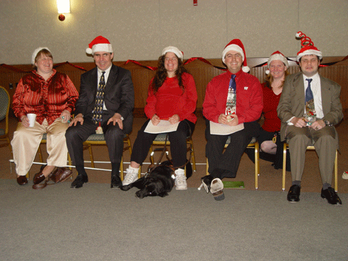 Pictured here wearing their Santa hats are (left to right) Terri Uttermohlen, Jim McCarthy, Melissa Riccobono, Mark Riccobono, Karen Zakhnini, and leader of the group Chris Danielsen.