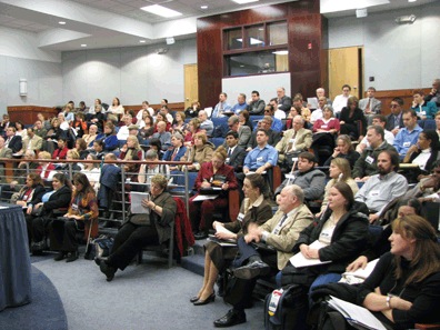 The NFB of Utah auditorium in the Jernigan Institute was filled to capacity when Joanne Wilson, executive director of affiliate action, called the Dare to Be Remarkable conference to order.