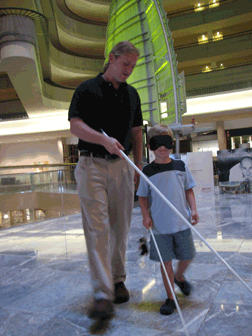 Darick Williamson, faculty member at Louisiana Tech University, works with a little boy during the 2007 cane walk.