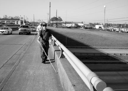 Ruston may be a small town, but in some places the traffic rushes past. Adam strides out confidently despite the traffic at his elbow.