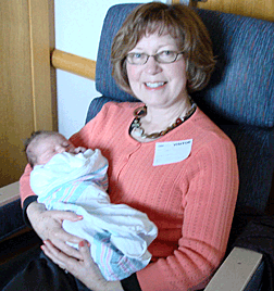 Sylvia holding her brand new granddaughter Olivia