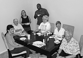 Gathered around the table after dinner, left to right, are Barbara Wheeler, John Batron, Duncan Larsen, Wayne Marshall, Lorraine Thompson, Marie Dambrosky, and Rudi Gelsey.