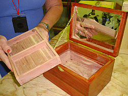 A cherry jewelry case with fitted tray
