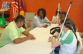 Summer students at a table in the cafeteria