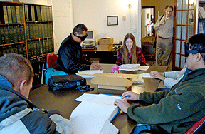 Melody Wartenbee teaching a group of Braille students