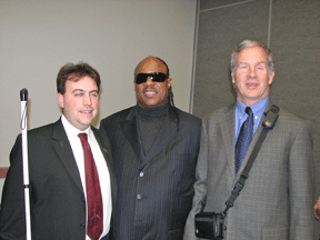 Left to right, Jernigan Institute Executive Director Mark Riccobono, Stevie Wonder, and Sendero CEO Mike May pose for a picture following the Wonder Vision Reception, where several mainstream electronic devices were recognized for their value to everyone.
