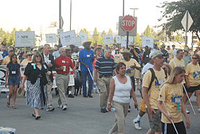 March for Independence participants walk along a street in Dallas.