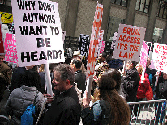 In the picket line NFB President Marc Maurer carries a sign reading "Why Don't Authors Want to be Heard?"