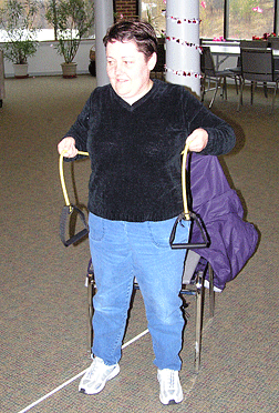 Terri Griffon exercises using a resistance band.