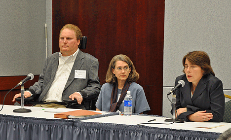 Participants in Panel II, addressing methods of ADA enforcement, are shown on the stage behind the head table. From left to right are Tim Fox, Amy Robertson, and Maura Healey.
