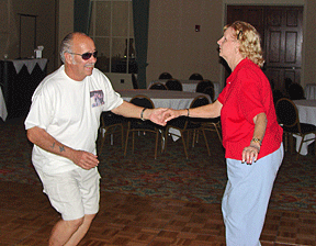 Don and Nancy Burns dance together.