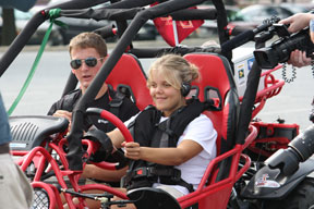 Addison Hugen drives the prototype with Virginia Tech student Greg Jannaman along as passenger and advisor.