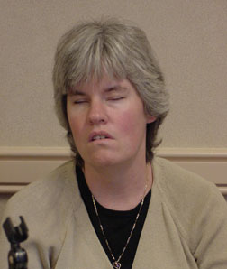 Elizabeth Campbell listens to a speaker